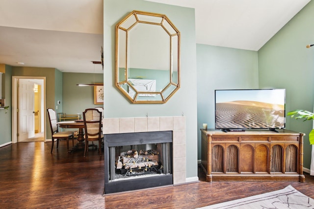 3197 Primrose Ln, Ypsilanti, MI 48197 - living room featuring wood finished floors, lofted ceiling, and a tile fireplace