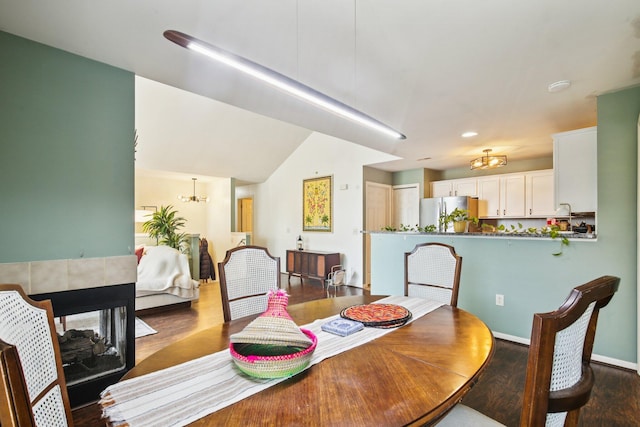 3197 Primrose Ln, Ypsilanti, MI 48197 - dining area featuring a chandelier and dark wood finished floors