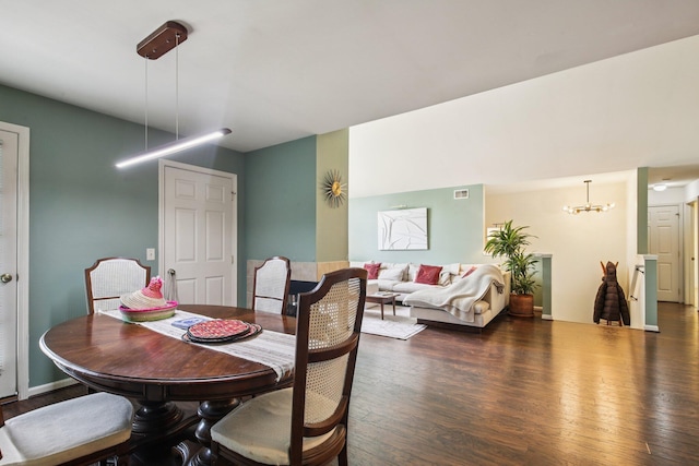 3197 Primrose Ln, Ypsilanti, MI 48197 - dining area featuring wood finished floors and a chandelier