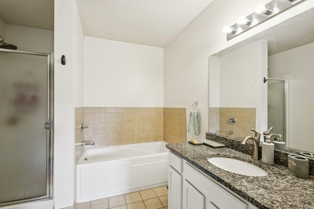 3197 Primrose Ln, Ypsilanti, MI 48197 - full bathroom with a shower stall, vanity, a bath, and tile patterned flooring