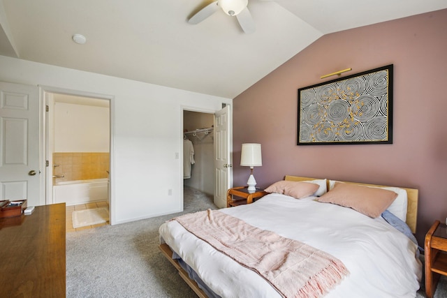 3197 Primrose Ln, Ypsilanti, MI 48197 - carpeted bedroom featuring vaulted ceiling, ensuite bathroom, ceiling fan, and a walk in closet
