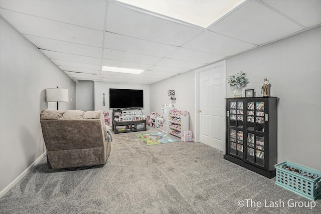 2851 18 Mile Rd, Kent City, MI 49330 - carpeted living area featuring a paneled ceiling and baseboards