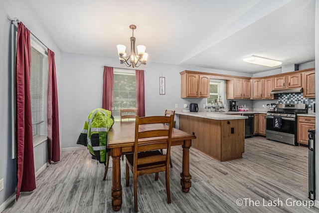 2851 18 Mile Rd, Kent City, MI 49330 - dining area with a chandelier and light wood finished floors