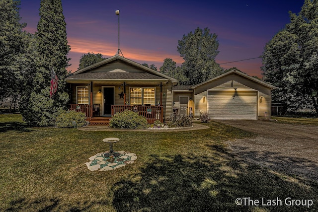 2851 18 Mile Rd, Kent City, MI 49330 - view of front of home featuring driveway, a lawn, a porch, and an attached garage