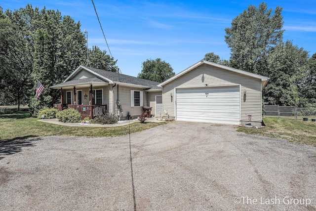 2851 18 Mile Rd, Kent City, MI 49330 - ranch-style house featuring a porch and driveway