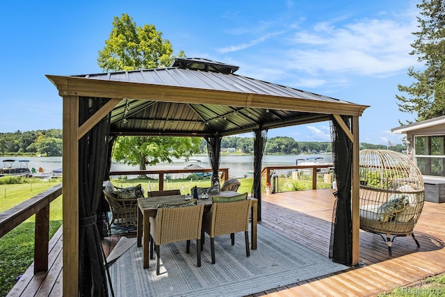 636 Swains Lake Dr, Concord, MI 49237 - wooden deck featuring a gazebo, a water view, and outdoor dining area