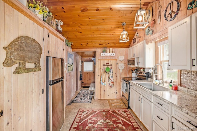 636 Swains Lake Dr, Concord, MI 49237 - kitchen featuring appliances with stainless steel finishes, wooden walls, lofted ceiling, wood ceiling, and pendant lighting