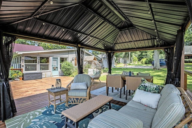 636 Swains Lake Dr, Concord, MI 49237 - wooden deck with outdoor dining area, a sunroom, a yard, and a gazebo