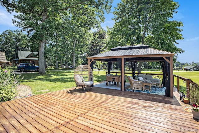 636 Swains Lake Dr, Concord, MI 49237 - wooden deck with a gazebo, outdoor lounge area, a lawn, and view of wooded area