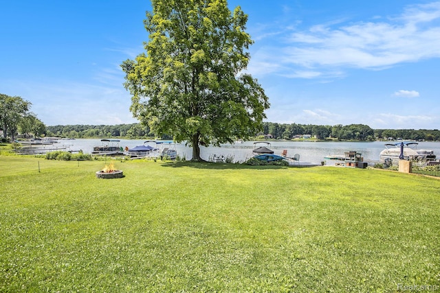 636 Swains Lake Dr, Concord, MI 49237 - view of green lawn featuring an outdoor fire pit and a water view