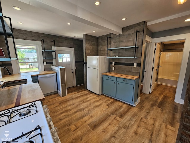 624 E Comstock St, Owosso, MI 48867 - kitchen featuring wood counters, white appliances, open shelves, wood finished floors, and recessed lighting