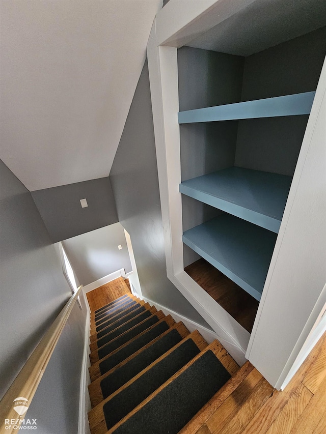624 E Comstock St, Owosso, MI 48867 - stairs featuring wood finished floors and baseboards