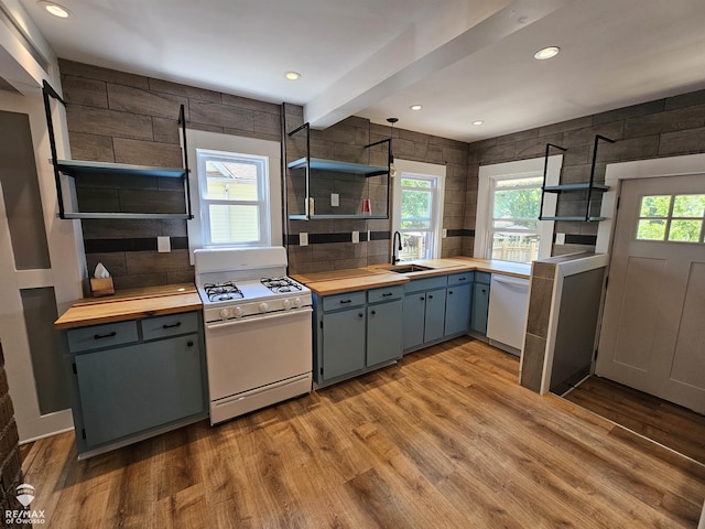624 E Comstock St, Owosso, MI 48867 - kitchen with open shelves, white appliances, butcher block countertops, wood finished floors, and recessed lighting