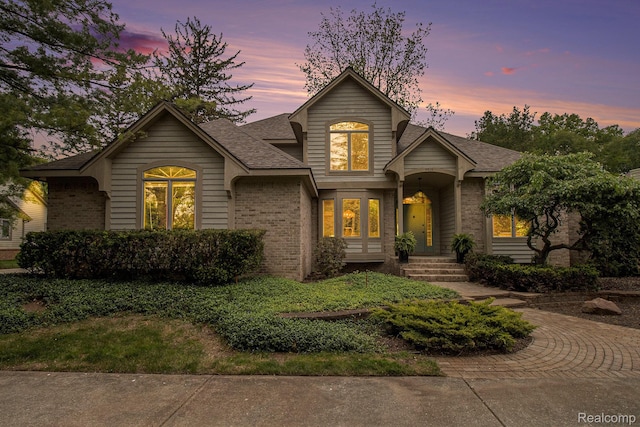 6512 White Lake Rd, Clarkston, MI 48346 - traditional-style home with brick siding and roof with shingles