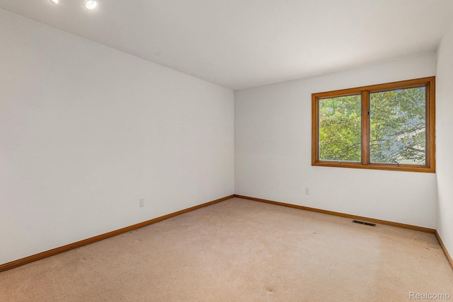 6512 White Lake Rd, Clarkston, MI 48346 - carpeted empty room featuring baseboards