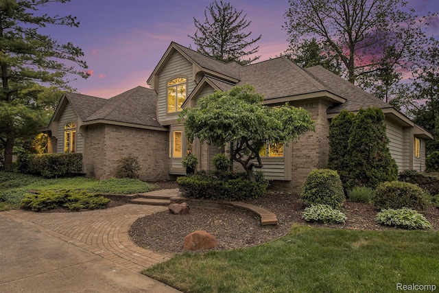 6512 White Lake Rd, Clarkston, MI 48346 - view of front of house featuring brick siding and a shingled roof