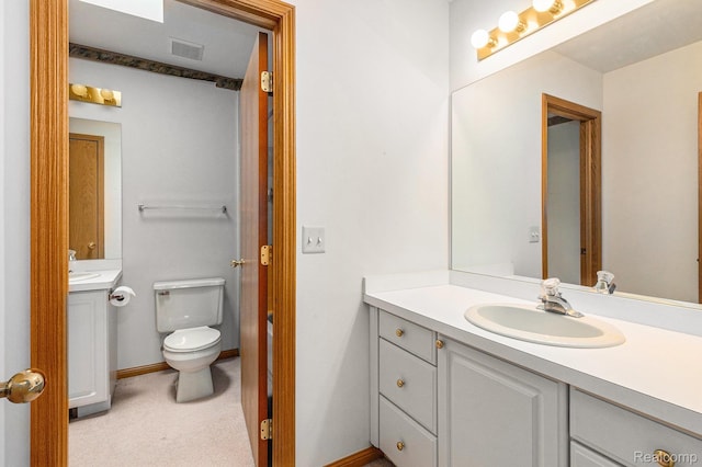 6512 White Lake Rd, Clarkston, MI 48346 - bathroom featuring vanity and toilet
