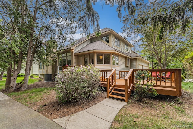 6512 White Lake Rd, Clarkston, MI 48346 - view of front of home with a wooden deck and a shingled roof