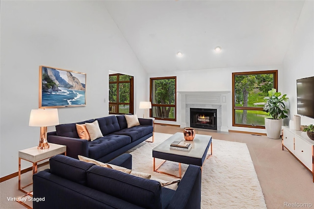 6512 White Lake Rd, Clarkston, MI 48346 - living room featuring healthy amount of natural light, a high end fireplace, high vaulted ceiling, recessed lighting, and light carpet