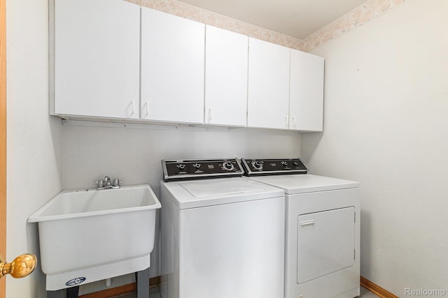 6512 White Lake Rd, Clarkston, MI 48346 - washroom with cabinet space and independent washer and dryer