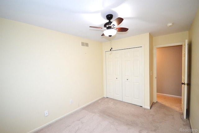 2 Cornell Ct, Dearborn, MI 48124 - unfurnished bedroom featuring light carpet, a closet, and a ceiling fan
