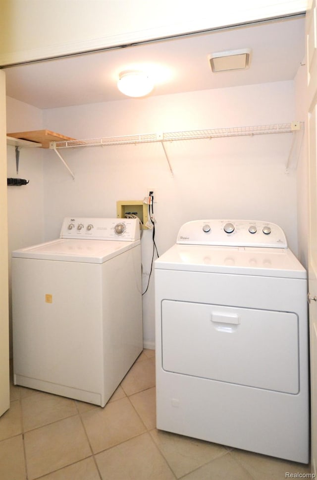 2 Cornell Ct, Dearborn, MI 48124 - washroom featuring separate washer and dryer and light tile patterned flooring