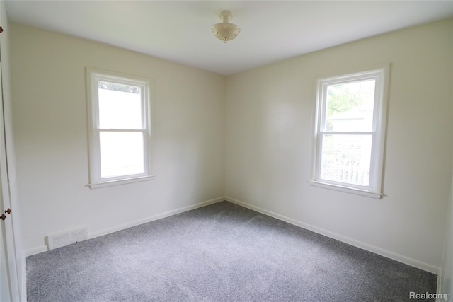 3922 Hogarth Ave, Flint, MI 48532 - carpeted empty room featuring baseboards