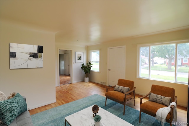 3922 Hogarth Ave, Flint, MI 48532 - living area featuring light wood finished floors and baseboards