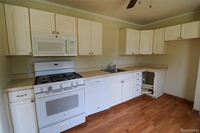 3922 Hogarth Ave, Flint, MI 48532 - kitchen with white appliances, ornamental molding, light countertops, light wood-style floors, and ceiling fan