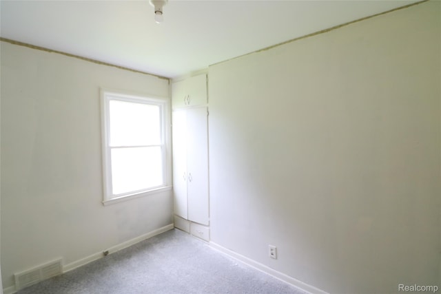 3922 Hogarth Ave, Flint, MI 48532 - spare room featuring light colored carpet and baseboards