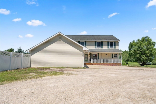 7350 N Territorial Rd, Dexter, MI 48130 - view of front of property with a porch and driveway