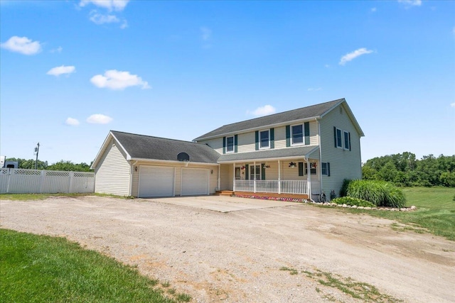 7350 N Territorial Rd, Dexter, MI 48130 - view of front of property featuring a porch, driveway, and a garage