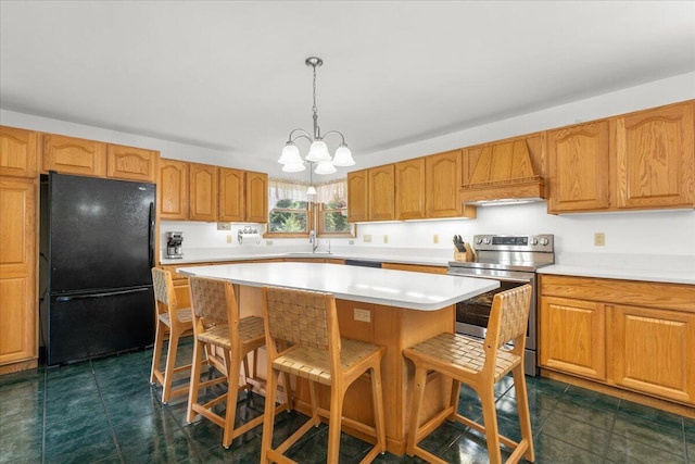 7350 N Territorial Rd, Dexter, MI 48130 - kitchen with electric range, freestanding refrigerator, light countertops, a chandelier, and a kitchen bar