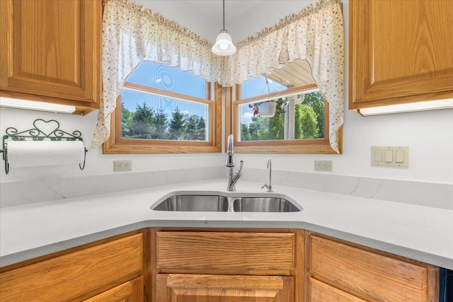 7350 N Territorial Rd, Dexter, MI 48130 - kitchen featuring light countertops and pendant lighting