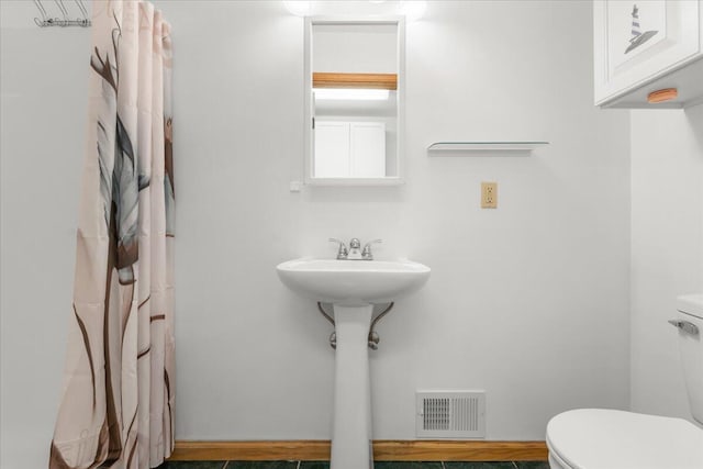 7350 N Territorial Rd, Dexter, MI 48130 - bathroom with toilet and a shower with curtain