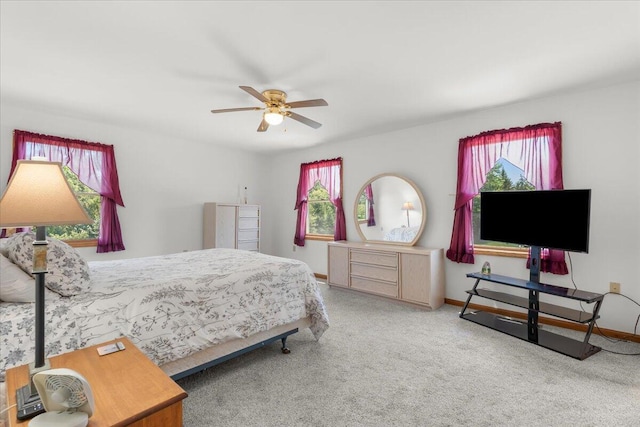 7350 N Territorial Rd, Dexter, MI 48130 - bedroom featuring multiple windows, carpet, and ceiling fan