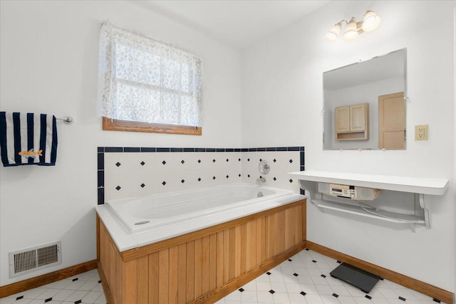 7350 N Territorial Rd, Dexter, MI 48130 - full bathroom featuring a bath and baseboards