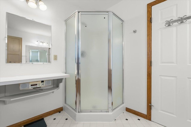 7350 N Territorial Rd, Dexter, MI 48130 - bathroom featuring baseboards and a stall shower