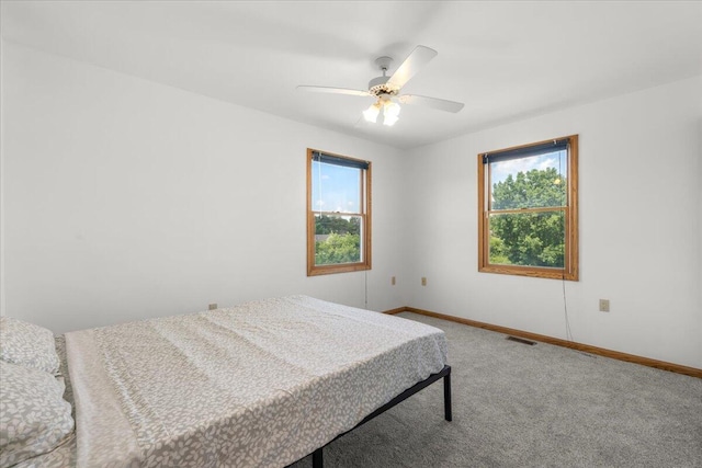 7350 N Territorial Rd, Dexter, MI 48130 - carpeted bedroom with baseboards and a ceiling fan