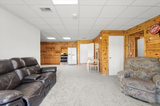 7350 N Territorial Rd, Dexter, MI 48130 - living room featuring light carpet and wooden walls