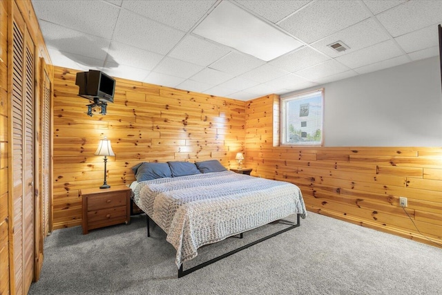 7350 N Territorial Rd, Dexter, MI 48130 - carpeted bedroom featuring wood walls and a drop ceiling