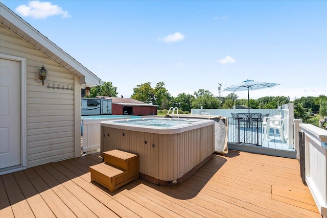 7350 N Territorial Rd, Dexter, MI 48130 - deck featuring a hot tub and outdoor dining space