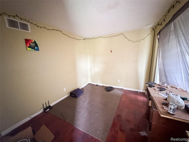 7950 Pinckney Rd, Pinckney, MI 48169 - spare room featuring baseboards and concrete flooring