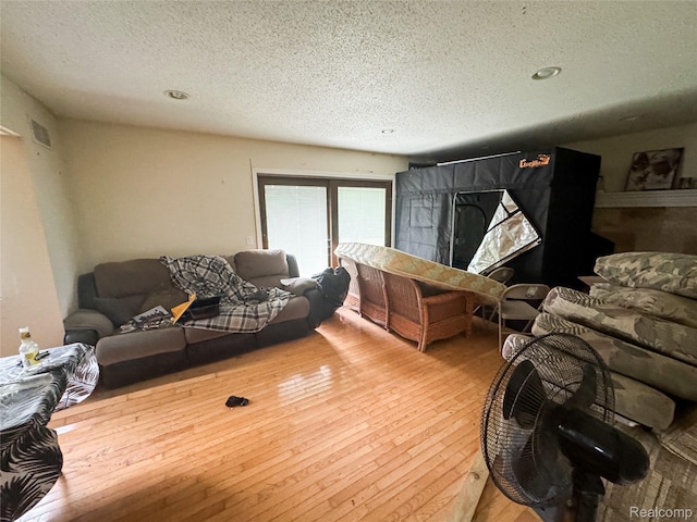 7950 Pinckney Rd, Pinckney, MI 48169 - living room with a textured ceiling and hardwood / wood-style floors