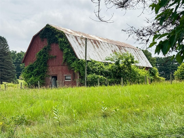 7950 Pinckney Rd, Pinckney, MI 48169 - view of side of property with a barn, a gambrel roof, an outbuilding, and a metal roof