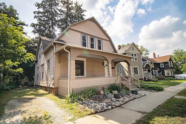 422 S Winter St, Adrian, MI 49221 - colonial inspired home with covered porch and a gambrel roof