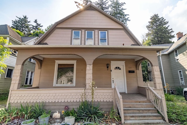422 S Winter St, Adrian, MI 49221 - colonial inspired home with a gambrel roof and a porch