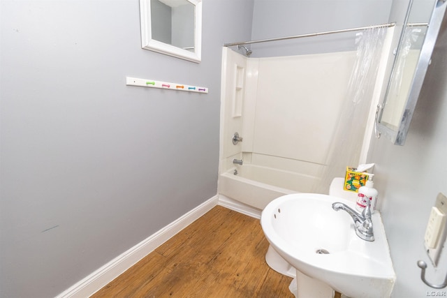 422 S Winter St, Adrian, MI 49221 - bathroom featuring bathtub / shower combination and wood finished floors