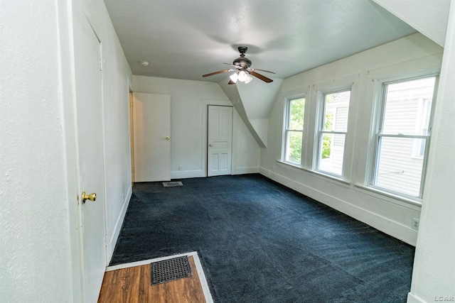 422 S Winter St, Adrian, MI 49221 - bonus room with a ceiling fan, dark colored carpet, and lofted ceiling