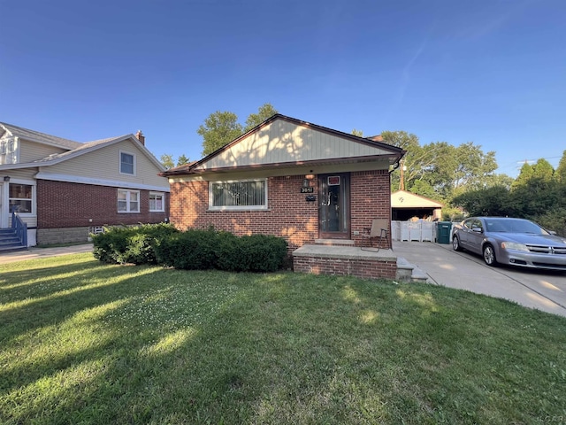 3841 Westpoint St, Dearborn, MI 48124 - bungalow with brick siding, a front lawn, and entry steps